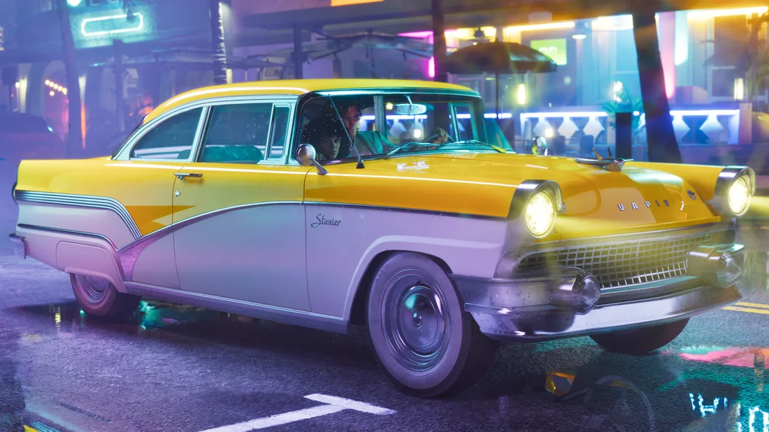 Yellow and white Vapid Stanier sedan on a neon-lit street at night